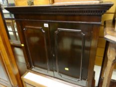 An antique mahogany table top cabinet with shelved interior