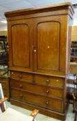 A Victorian mahogany press cupboard with four-drawer base