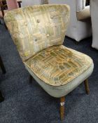 A retro wingback chair with Arabesque-type upholstery