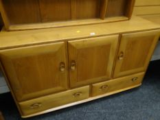 An Ercol blonde compact sideboard with two drawers & three cupboards
