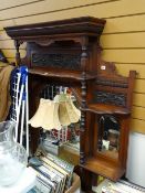 A good Edwardian carved overmantel mirror with shelves