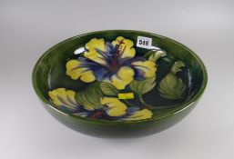 A Moorcroft green ground Hibiscus patterned decorated bowl