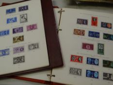 Four vintage stamp albums