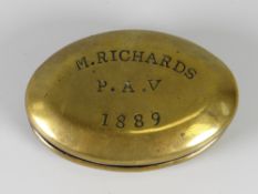 A small brass tobacco tin, engraved M Richards P.A.V 1889 (A/F)