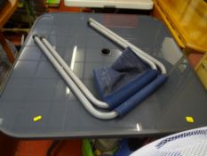 Washing basket full of hand tools and a bag of sandpaper and sanding equipment