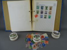 Small collection of vintage world stamps and three Ayshford china pill boxes depicting scenes of