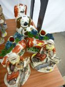 Two Staffs comforter dogs and two pairs of reproduction Staffs figurines
