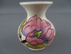Moorcroft 'Magnolia' small squat vase on a cream ground