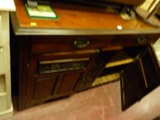Polished wood sideboard with two drawers and two base cupboards with carvings to the upper panels