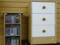 Modern CD cabinet with contents and a three drawer melamine bedside chest
