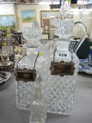 Four glass decanters and a small oil bottle along with two EP 'Gin' and 'Port' labels