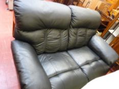 Black faux leather settee and a recliner armchair