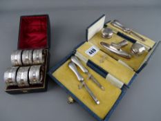 Boxed silver manicure set and thimble and a cased set of EP napkin rings