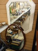 Mahogany oval framed vintage mirror and a painted oak example