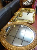 Oval gilt framed mirror with extending sconce and an ornate gilt framed mirror