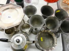 EP hammered effect tazza on barley twist column, six pewter style goblets, a three piece Sheffield