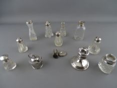 Collection of glass bottles and containers, most with silver tops or rims (varying conditions)