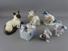 Royal Doulton model of a Siamese cat, no. 1559 and five porcelain models of cats by Lladro and Nao