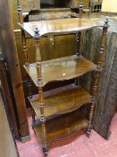 Rosewood effect four drawer serpentine front whatnot (top gallery missing)