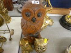 Two brass owls and a carved wooden owl