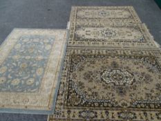 Three matching oblong rugs and another