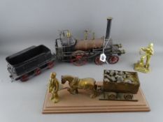 Vintage style tinplate steam engine and trolley car, a brass model of a miner with horse and cart on