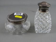 Two silver topped glass dressing table containers