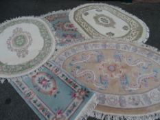 Parcel of five washed Chinese rugs, one oblong and four oval