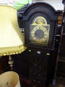 Eight day striking grandmother clock in an ebonized Jacobean style case with domed and spiral