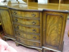 Mahogany centre pedestal tea/dining table with four mahogany chairs having front sabre legs and a