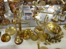 Five brass balance scales and a quantity of brass weights