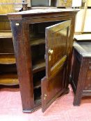 Antique oak hanging corner cupboard with two half doors (top and bottom having inset panels)