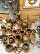 Large parcel of mainly copper jugs and similar items