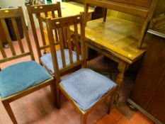Polished draw leaf dining table and three chairs