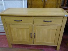 Modern light oak sideboard with two drawers and two cupboards