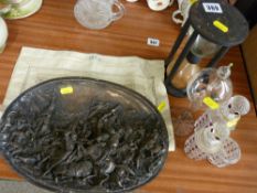 Cast mixed metal plaque of a battle scene inscribed 'Justin', a period hourglass, miscellaneous