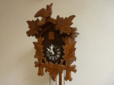 Cuckoo clock with weights