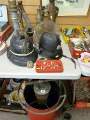 Large parcel of vintage fireman's equipment including brass nozzles, pump, helmet etc