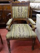 Edwardian oak elbow chair with upholstered back and arms