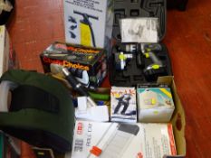 Boxed Piston air pump, a Challenge Extreme cordless hammer drill, a rubber made cooler carrier,