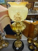 Good looking brass cherub decorated oil lamp with shade
