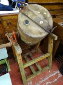 Wooden barrel butter churn on stand