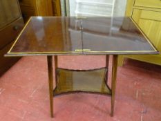 Mahogany and crossbanded Edwardian coffee table with shaped base shelf
