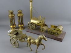 Brass model of Stephenson's Rocket on a plinth, a horse and carriage and two small hanging lamps