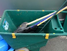 Plastic wheelbarrow and garden tools contents