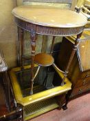 Circular mahogany occasional table with base shelf and reeded and turned supports and a reproduction