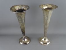 Two large hallmarked silver trumpet vases, loaded bases