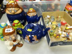 A collection of various Tetley Tea folk items including a teapot, money box, condiments etc