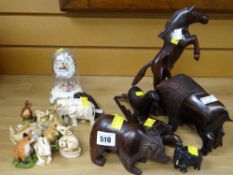 Collection of carved wooden animals together with a selection of resin & other animal figures