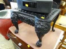 A black painted metallic antique footsman